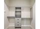 Walk-in closet featuring shelving, drawers, and hanging rods for optimal storage and organization of clothes at 562 Dowling Cir, Lady Lake, FL 32159