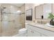 Well lit bathroom features a modern design and vanity with granite countertop at 6988 Lawrenceville Way, The Villages, FL 34762