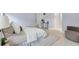Bright bedroom showcasing stylish decor, neutral tones, and comfortable furnishings at 6988 Lawrenceville Way, The Villages, FL 34762