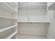 Spacious walk-in closet with built-in shelving and ample storage space at 6988 Lawrenceville Way, The Villages, FL 34762