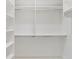 Interior view of walk-in closet, showcasing shelves and rod system at 6988 Lawrenceville Way, The Villages, FL 34762