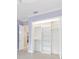 Bright closet featuring built-in shelving, hanging rods, and white doors for ample storage in the bedroom at 6988 Lawrenceville Way, The Villages, FL 34762