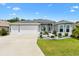 Charming single-Gathering home with a three-car garage, complemented by a well-maintained lawn at 6988 Lawrenceville Way, The Villages, FL 34762