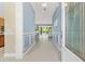 Inviting foyer showcasing detailed trim work, tiled floors, and a glimpse of the pool at 6988 Lawrenceville Way, The Villages, FL 34762
