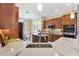 Modern kitchen featuring stainless steel appliances, granite countertops, and stylish backsplash at 6988 Lawrenceville Way, The Villages, FL 34762