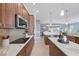 A kitchen with stainless steel appliances, an island and breakfast nook at 6988 Lawrenceville Way, The Villages, FL 34762