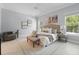 Bright main bedroom features elegant decor, neutral colors, tile floors, and large windows at 6988 Lawrenceville Way, The Villages, FL 34762