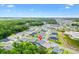 A beautiful community featuring lovely homes, lush green spaces, and a serene lake at 6988 Lawrenceville Way, The Villages, FL 34762