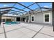 Expansive screened lanai with a pool, outdoor kitchen and ample patio space for entertaining at 6988 Lawrenceville Way, The Villages, FL 34762
