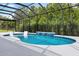 Inviting outdoor pool with water feature, chaise lounges, and screened enclosure, ideal for relaxation and privacy at 6988 Lawrenceville Way, The Villages, FL 34762