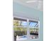 View of backyard swimming pool from interior of home through window at 6988 Lawrenceville Way, The Villages, FL 34762
