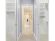 Walk-in closet features built-in shelving and ample storage space at 6988 Lawrenceville Way, The Villages, FL 34762