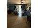 Comfortable living room with tile flooring, sliding glass doors, and plenty of natural light at 709 Calabria Way, Howey In The Hills, FL 34737