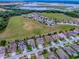 Aerial view of home near a lake and neighborhood at 718 Lake Douglas Dr, Groveland, FL 34736