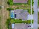 Aerial view showcasing the property's layout, pool, and backyard at 718 Lake Douglas Dr, Groveland, FL 34736