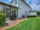 Spacious backyard featuring lush green grass and mature landscaping at 718 Lake Douglas Dr, Groveland, FL 34736