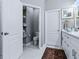 Bathroom featuring a walk-in closet with storage and commode in an alcove at 718 Lake Douglas Dr, Groveland, FL 34736