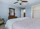 A cozy bedroom with a ceiling fan and a closet at 718 Lake Douglas Dr, Groveland, FL 34736