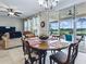 Breakfast nook adjacent to kitchen features chandelier and sliding doors to the patio at 718 Lake Douglas Dr, Groveland, FL 34736