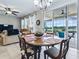 Breakfast nook adjacent to kitchen features chandelier and sliding doors to the patio at 718 Lake Douglas Dr, Groveland, FL 34736