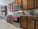 Kitchen featuring stainless steel oven and microwave and beautiful wood cabinetry at 718 Lake Douglas Dr, Groveland, FL 34736
