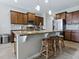 Charming kitchen with granite countertops, stainless appliances, and large kitchen island with seating at 718 Lake Douglas Dr, Groveland, FL 34736
