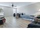 Open living room featuring wood-look floors, neutral paint, and lots of natural light at 718 Lake Douglas Dr, Groveland, FL 34736