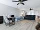 Open living room featuring wood-look floors and lots of natural light at 718 Lake Douglas Dr, Groveland, FL 34736