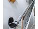 Staircase featuring a stair lift and decorative metal spindles at 718 Lake Douglas Dr, Groveland, FL 34736
