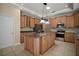 Spacious kitchen with granite countertops and stainless steel appliances at 7249 Chesterhill Cir, Mount Dora, FL 32757