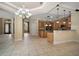 Open concept kitchen with wood cabinets and granite counters at 7249 Chesterhill Cir, Mount Dora, FL 32757