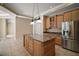 Modern kitchen featuring a large island with granite countertops and stainless appliances at 7249 Chesterhill Cir, Mount Dora, FL 32757