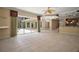 Open concept living room with access to the kitchen and backyard pool at 7249 Chesterhill Cir, Mount Dora, FL 32757