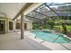 Private screened-in pool area with a pool, patio, and lush landscaping for outdoor enjoyment at 7249 Chesterhill Cir, Mount Dora, FL 32757
