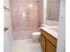 Bathroom featuring a tub with shower, sink with vanity and tile flooring at 739 Cortez Ave, The Villages, FL 32159
