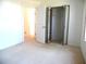Bedroom with carpet flooring, closet with mirrored sliding doors at 739 Cortez Ave, The Villages, FL 32159