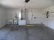 Spacious two car garage with utilitarian sink and storage shelving at 739 Cortez Ave, The Villages, FL 32159