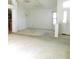 Open living area featuring a vaulted ceiling and a partial view of the kitchen at 739 Cortez Ave, The Villages, FL 32159