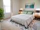 Light and airy bedroom with ample natural light, stylish accents and décor, and a relaxing ambiance at 739 Cortez Ave, The Villages, FL 32159