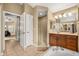 Bathroom with a glass enclosed shower, soaking tub and lots of vanity space at 7685 Lake Angelina Dr, Mount Dora, FL 32757