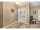 Welcoming entryway featuring tile floors, decorative door with glass and adjacent chair at 7685 Lake Angelina Dr, Mount Dora, FL 32757
