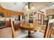 Charming kitchen with breakfast table and chairs, providing a cozy dining space at 7685 Lake Angelina Dr, Mount Dora, FL 32757