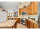A spacious kitchen with granite counters, stainless appliances, and ample cabinet space for the home chef at 7685 Lake Angelina Dr, Mount Dora, FL 32757