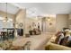 Spacious living room featuring neutral walls, carpet flooring, and bright, natural light at 7685 Lake Angelina Dr, Mount Dora, FL 32757