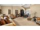 Open-concept living room featuring a dining area, large window, and stylish furniture at 7685 Lake Angelina Dr, Mount Dora, FL 32757