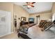 Bright main bedroom featuring a ceiling fan, neutral colors, an ensuite bathroom and a closet at 7685 Lake Angelina Dr, Mount Dora, FL 32757