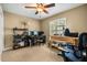 Office/bedroom with a ceiling fan, neutral colors, plantation shutters and desk area at 7685 Lake Angelina Dr, Mount Dora, FL 32757