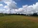 Open lot with clear skies, ready for building a home or agricultural development at 7701 Groveland Farms Rd, Groveland, FL 34736