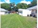 Spacious backyard with a well-manicured lawn and surrounding mature trees offering ample shade at 8431 Sw 93Rd Pl # F, Ocala, FL 34481