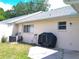 Exterior shot showcasing the backyard featuring a grill and a well-maintained lawn at 8431 Sw 93Rd Pl # F, Ocala, FL 34481